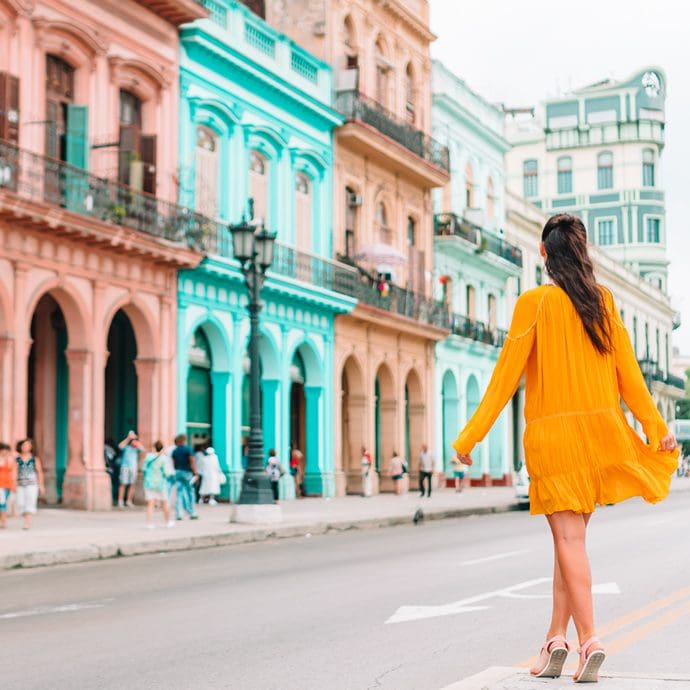 Woman crossing the road in Havana, Cuba