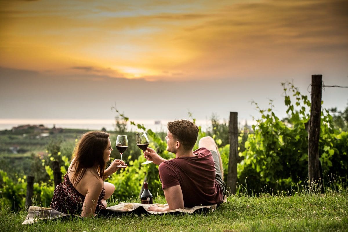 Couple in Vina Koper Wine Celler Vineyards - Slovenia Tourism/Vid Ponikvar