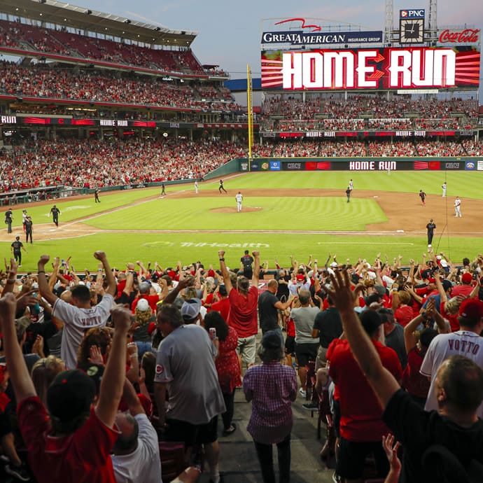 Crowd celebrating a home run at Great American Ball Park, the home stadium of the Cincinnati Reds - Visit Cincy