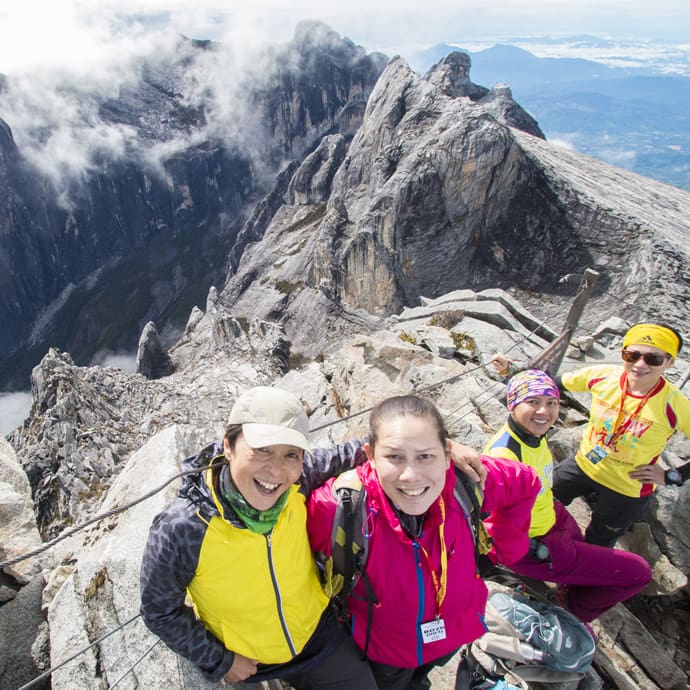 Climbers celebrating at the summit of Mount Kinabalu in Sabah, Malaysia - Sabah Tourism/Murphy Ng