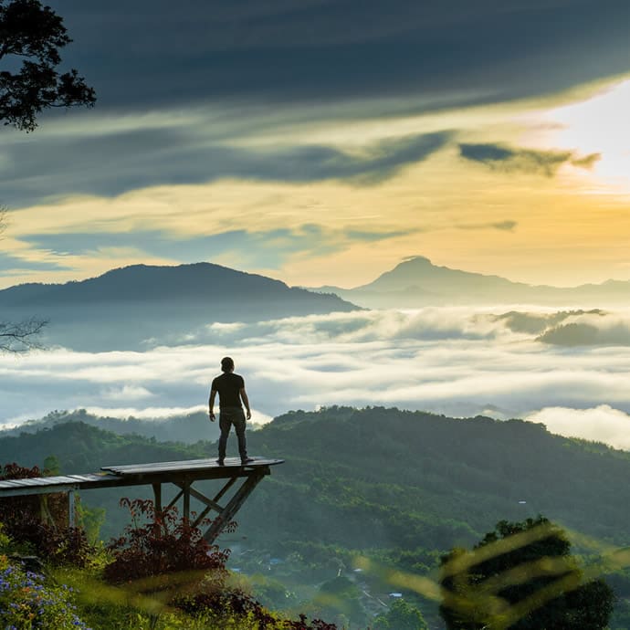 Standing on the wooden viewing platform at Tambiau Forest House in Ranau, Sabah - Sabah Tourism/Khairul Muzzammil